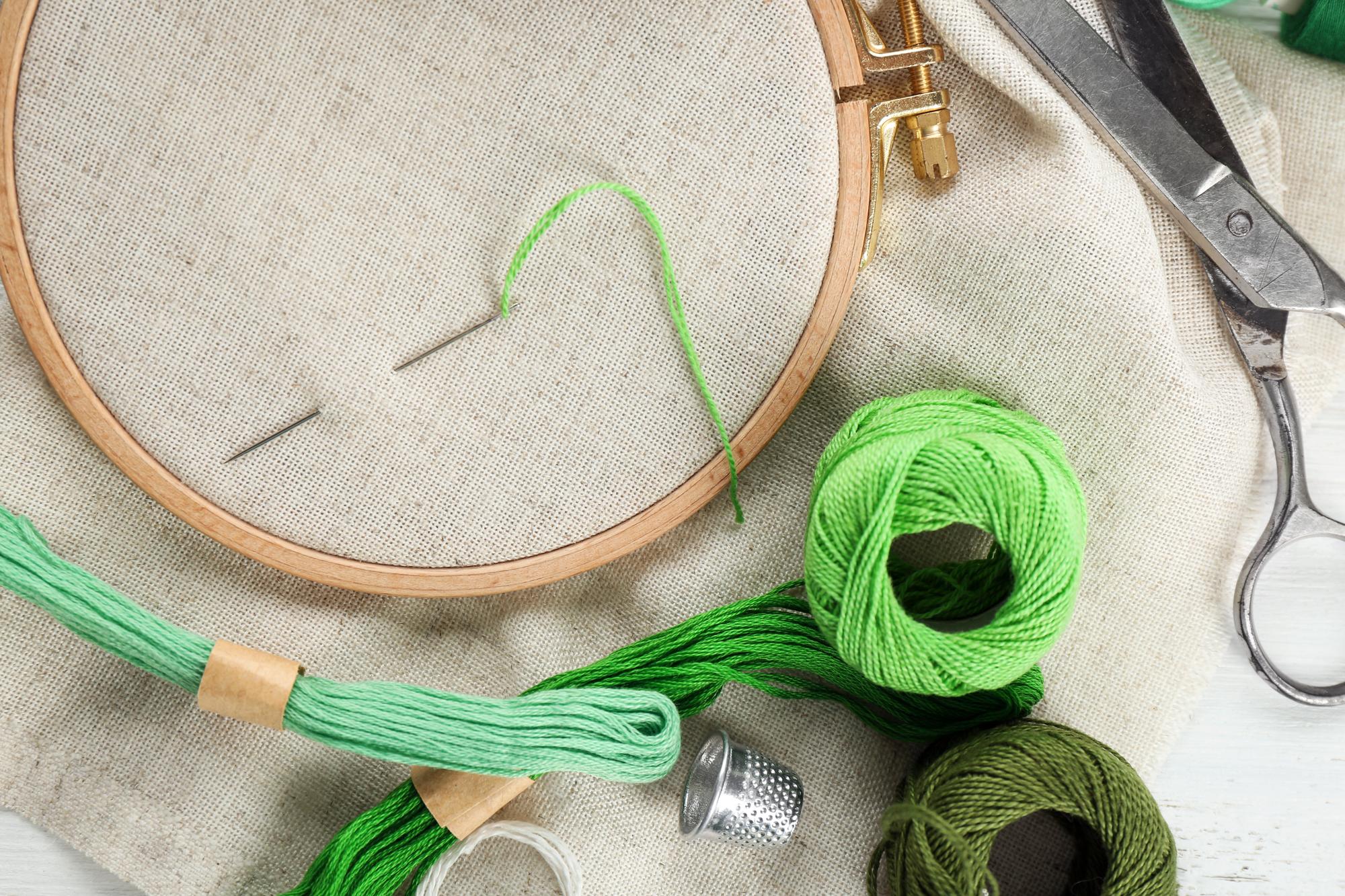atelier table with hoop and threads